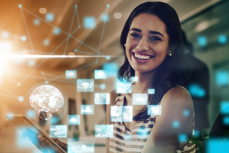 Smiling woman using a digital interface with floating holographic icons